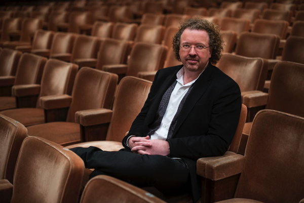 Stéphane Denève in a theatre seat